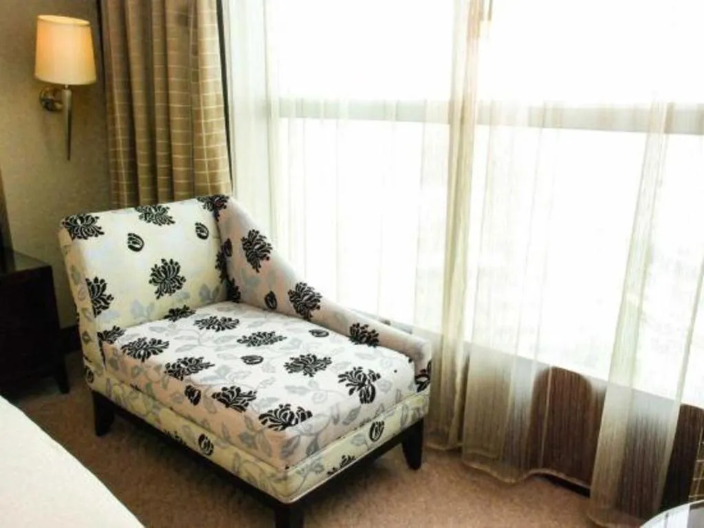 Bed in Chinflux Mandarin Hotel