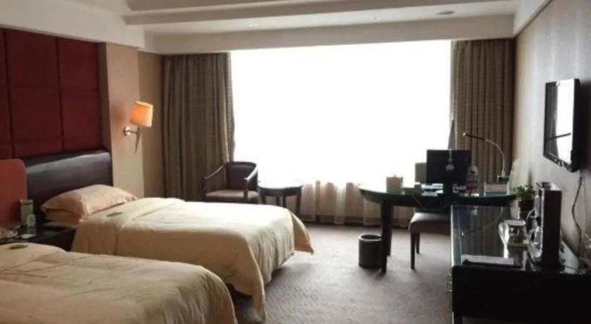 Bed in Chinflux Mandarin Hotel