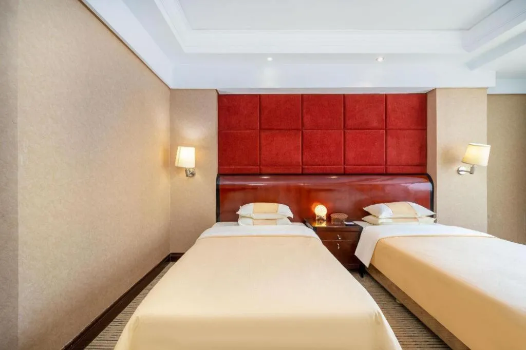 Bed in Chinflux Mandarin Hotel