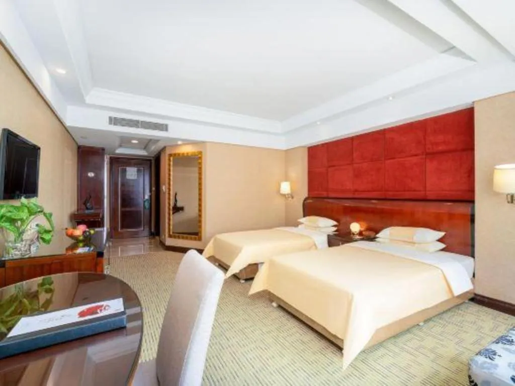 Bed in Chinflux Mandarin Hotel