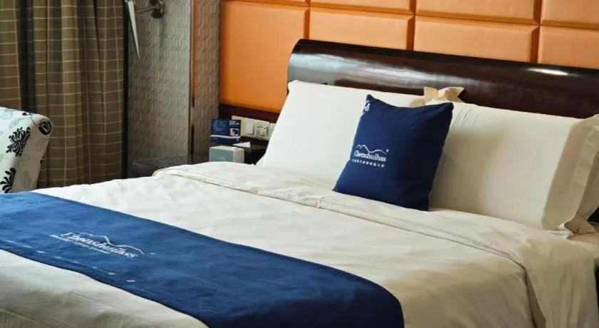 Bed in Chinflux Mandarin Hotel