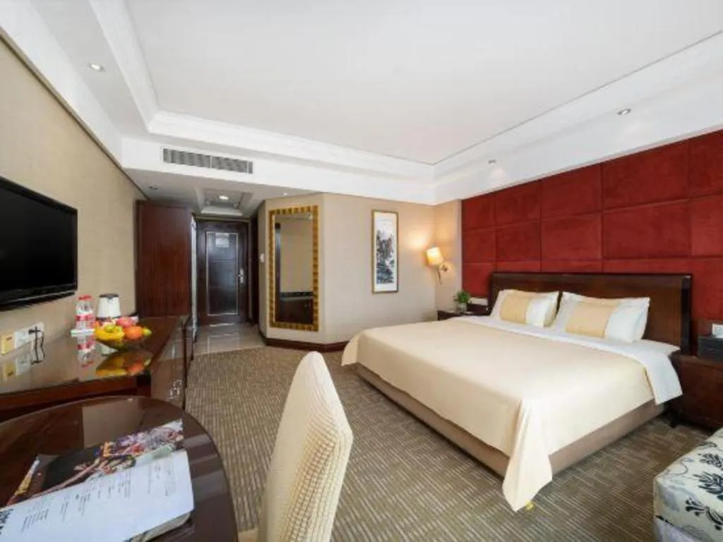 Bed in Chinflux Mandarin Hotel