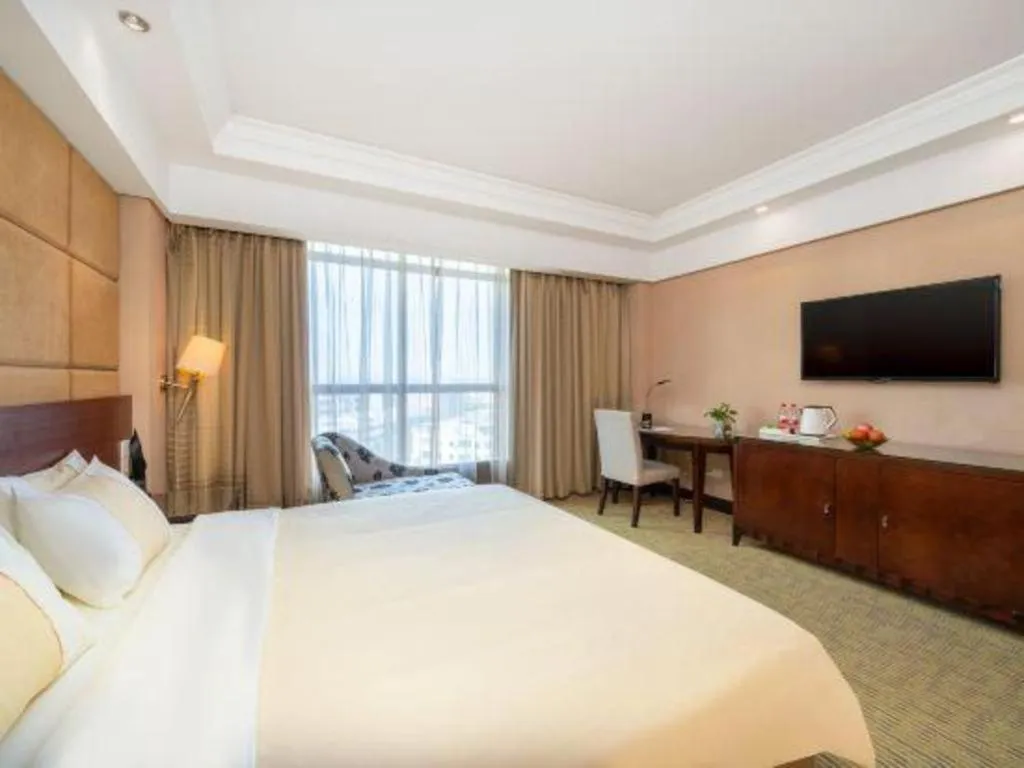 Bed in Chinflux Mandarin Hotel