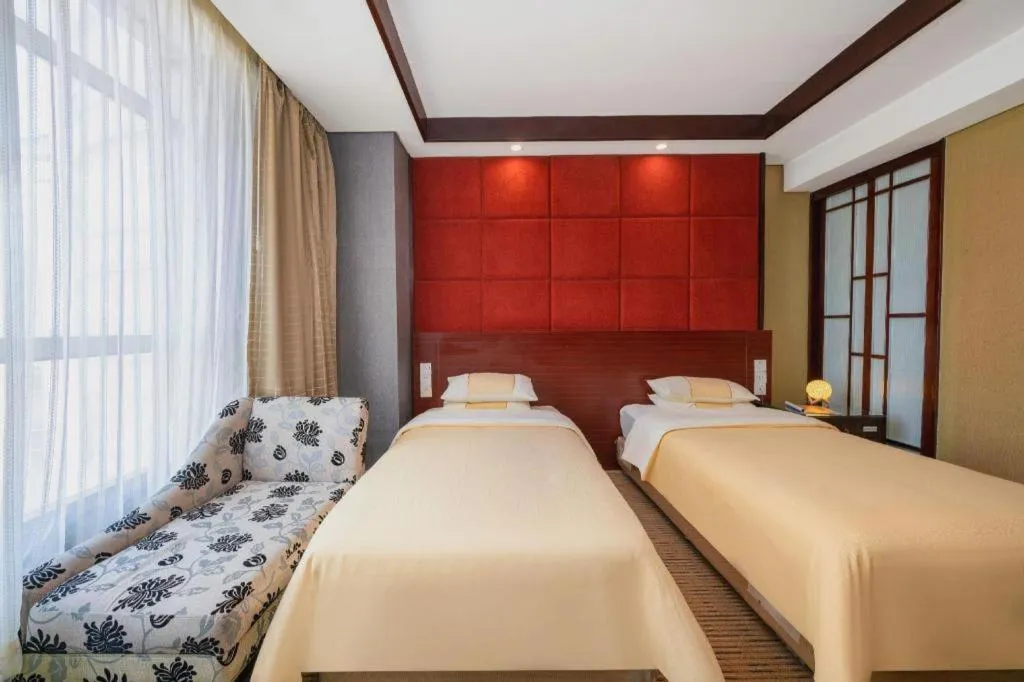 Bed in Chinflux Mandarin Hotel