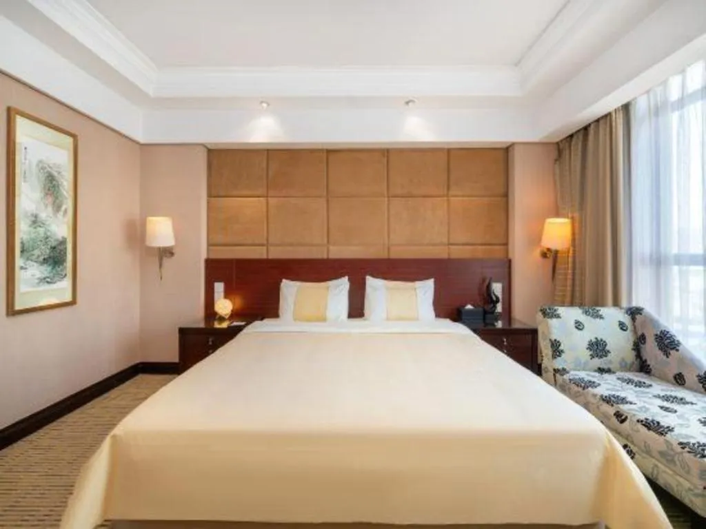 Bed in Chinflux Mandarin Hotel