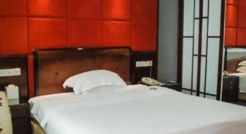 Bed in Chinflux Mandarin Hotel