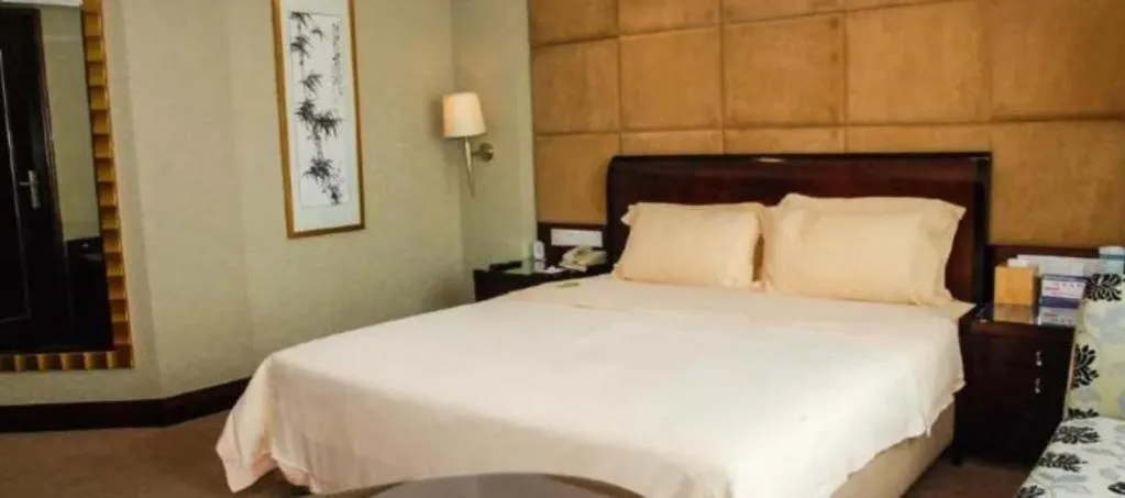 Bed in Chinflux Mandarin Hotel
