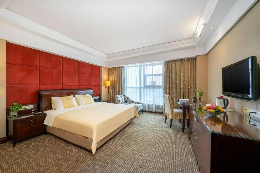Bed in Chinflux Mandarin Hotel
