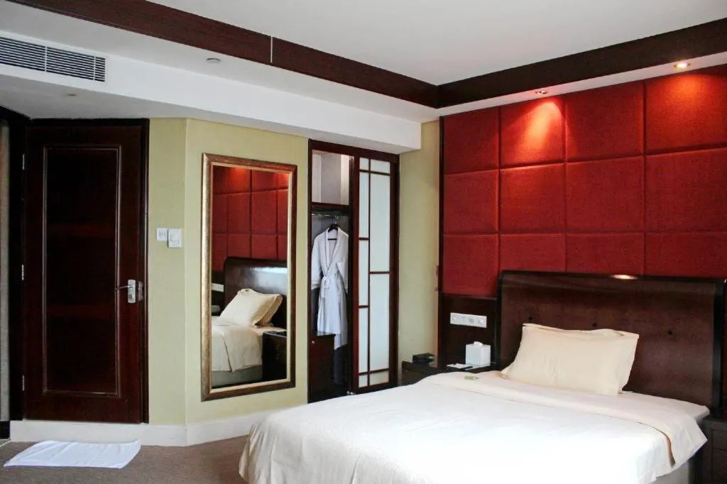 Bed in Chinflux Mandarin Hotel