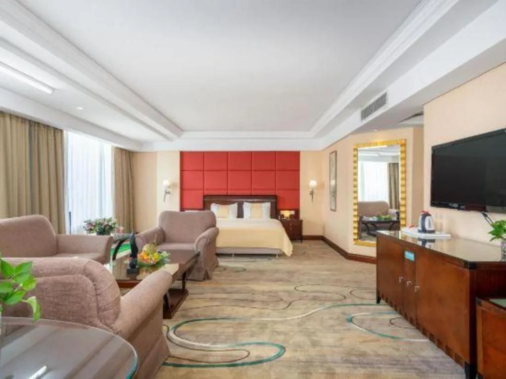 Bed in Chinflux Mandarin Hotel