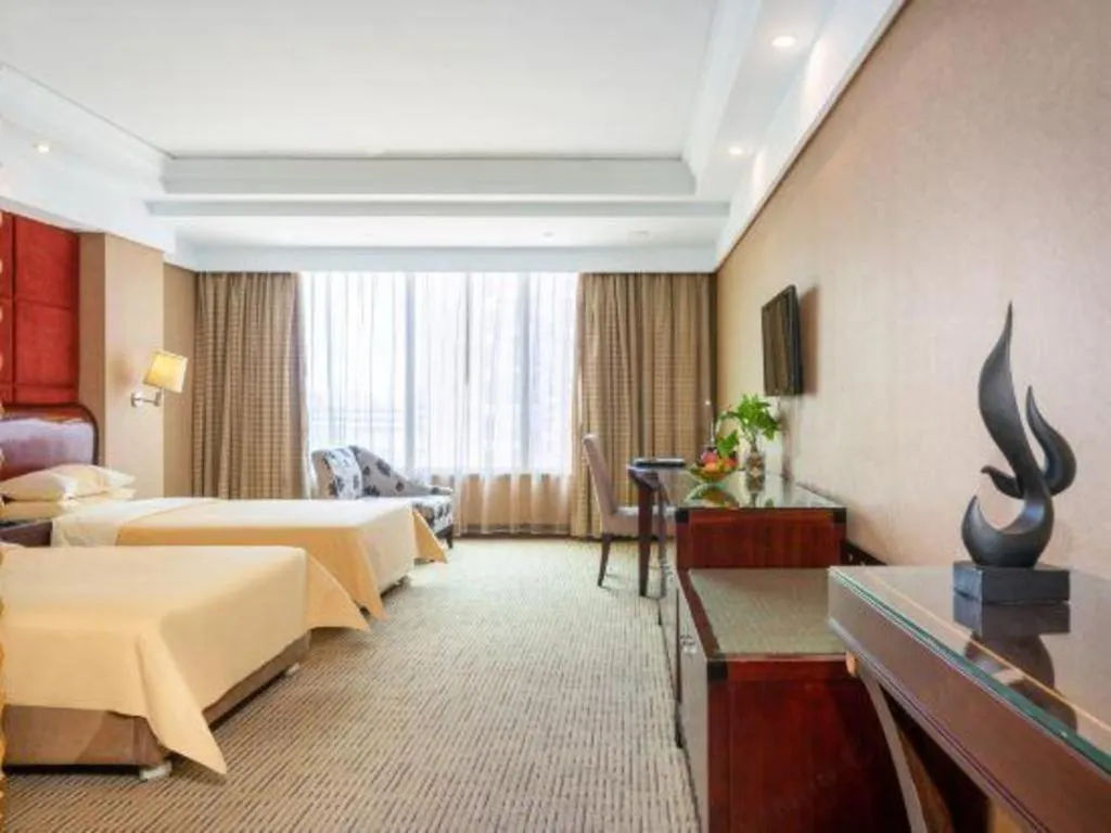 Bed in Chinflux Mandarin Hotel