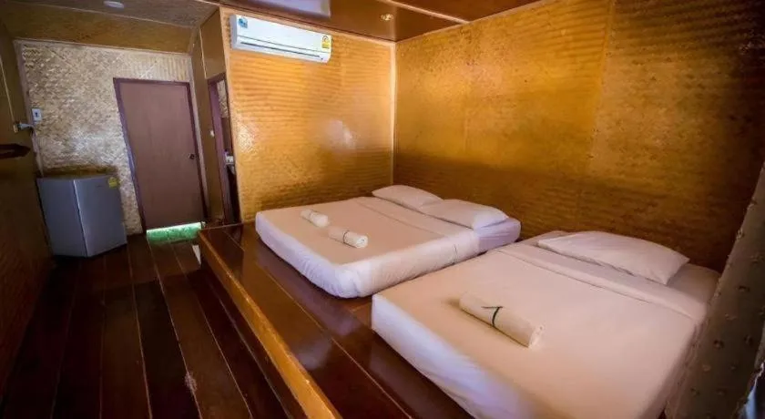 Bed in Tayan Resort Kanchanaburi