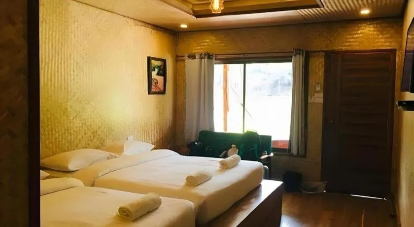 Bed in Tayan Resort Kanchanaburi