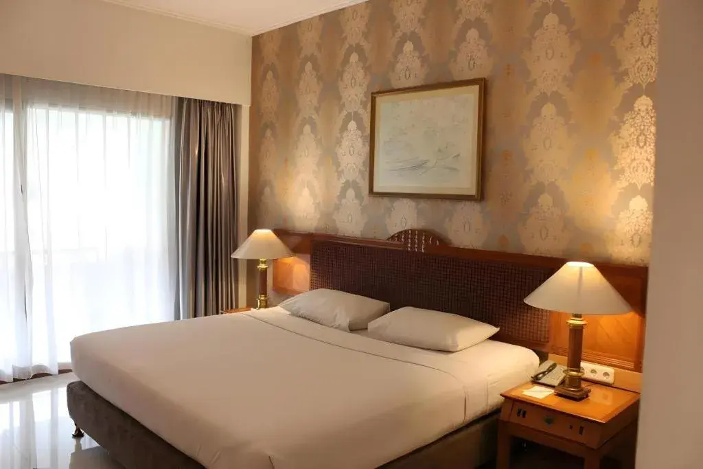 Bed in Bumi Wiyata Hotel Bed in Bumi Wiyata Hotel