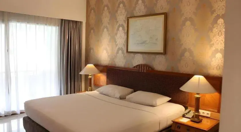 Bed in Bumi Wiyata Hotel Bed in Bumi Wiyata Hotel