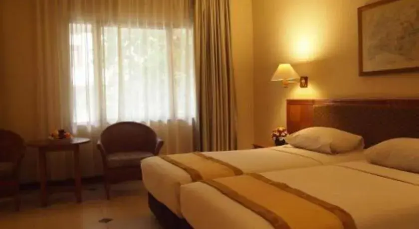 Bed in Bumi Wiyata Hotel Bed in Bumi Wiyata Hotel