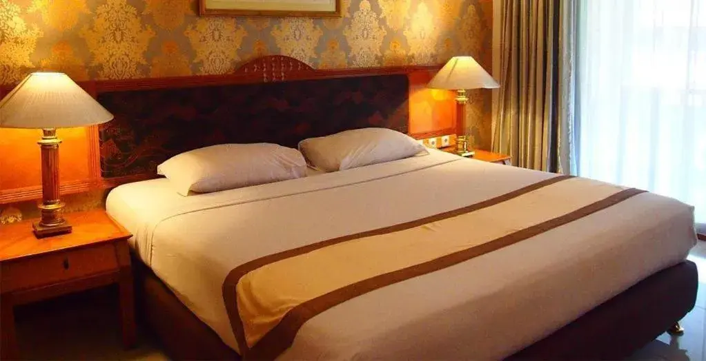 Bed in Bumi Wiyata Hotel Bed in Bumi Wiyata Hotel