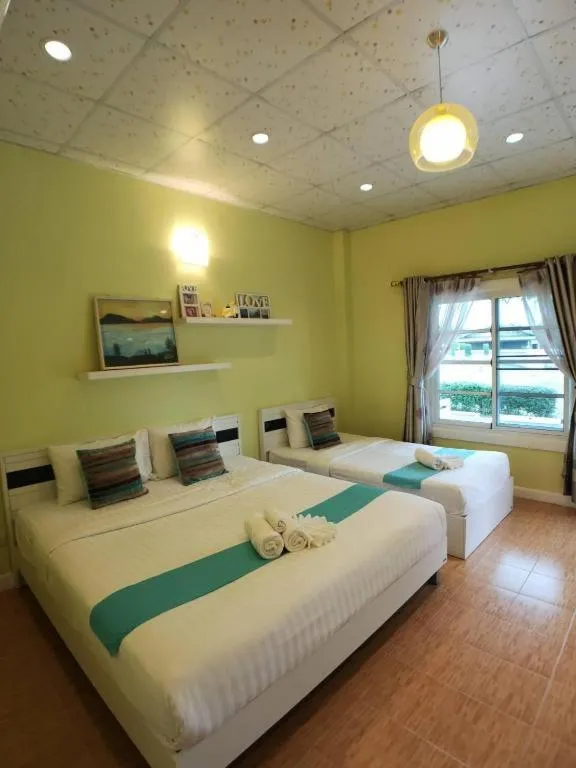 Bed in Chiangkhan Gallery Resort
