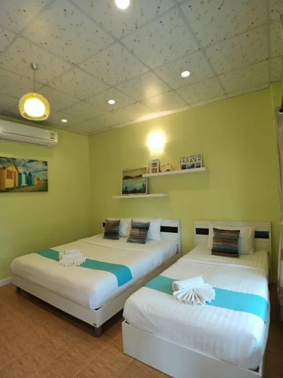 Bed in Chiangkhan Gallery Resort