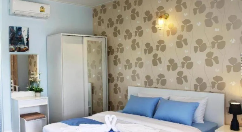 Bed in Chiangkhan Gallery Resort