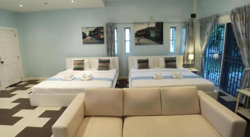 Bed in Chiangkhan Gallery Resort