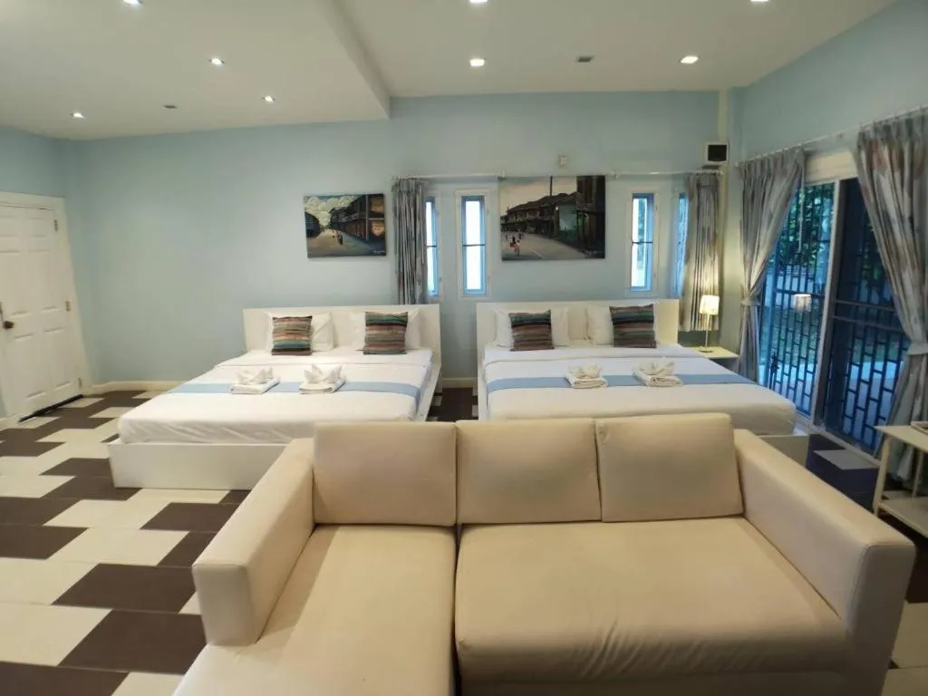 Bed in Chiangkhan Gallery Resort