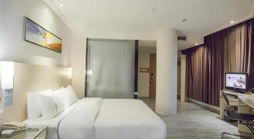 Bed in City Comfort Inn Dongxing National Trade Port Bed in City Comfort Inn Dongxing National Trade Port