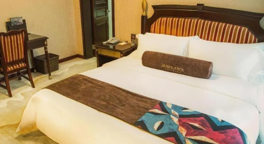 Bed in James Joyce Coffetel Qinhuangdao Taiyangcheng Wenhua Road