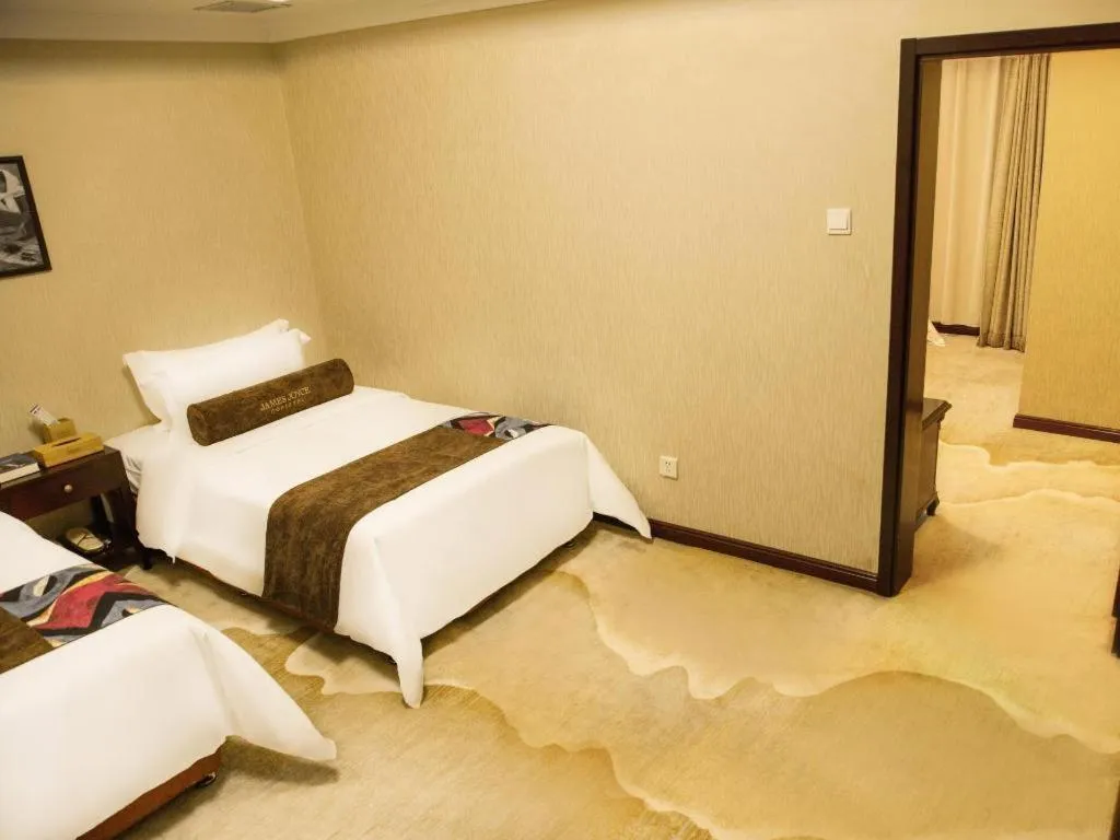 Bed in James Joyce Coffetel Qinhuangdao Taiyangcheng Wenhua Road