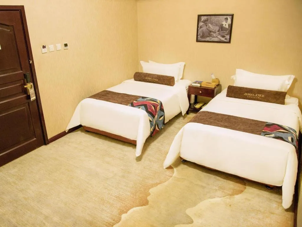 Bed in James Joyce Coffetel Qinhuangdao Taiyangcheng Wenhua Road