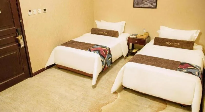 Bed in James Joyce Coffetel Qinhuangdao Taiyangcheng Wenhua Road