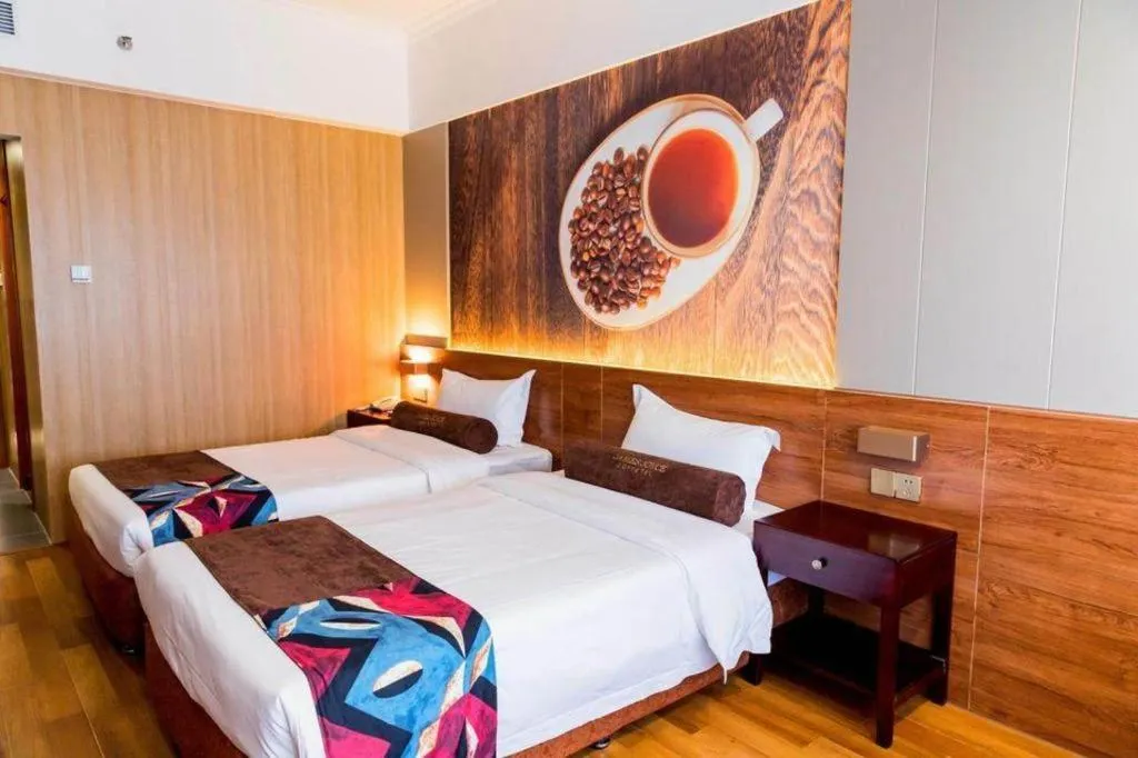 Bed in James Joyce Coffetel Qinhuangdao Taiyangcheng Wenhua Road