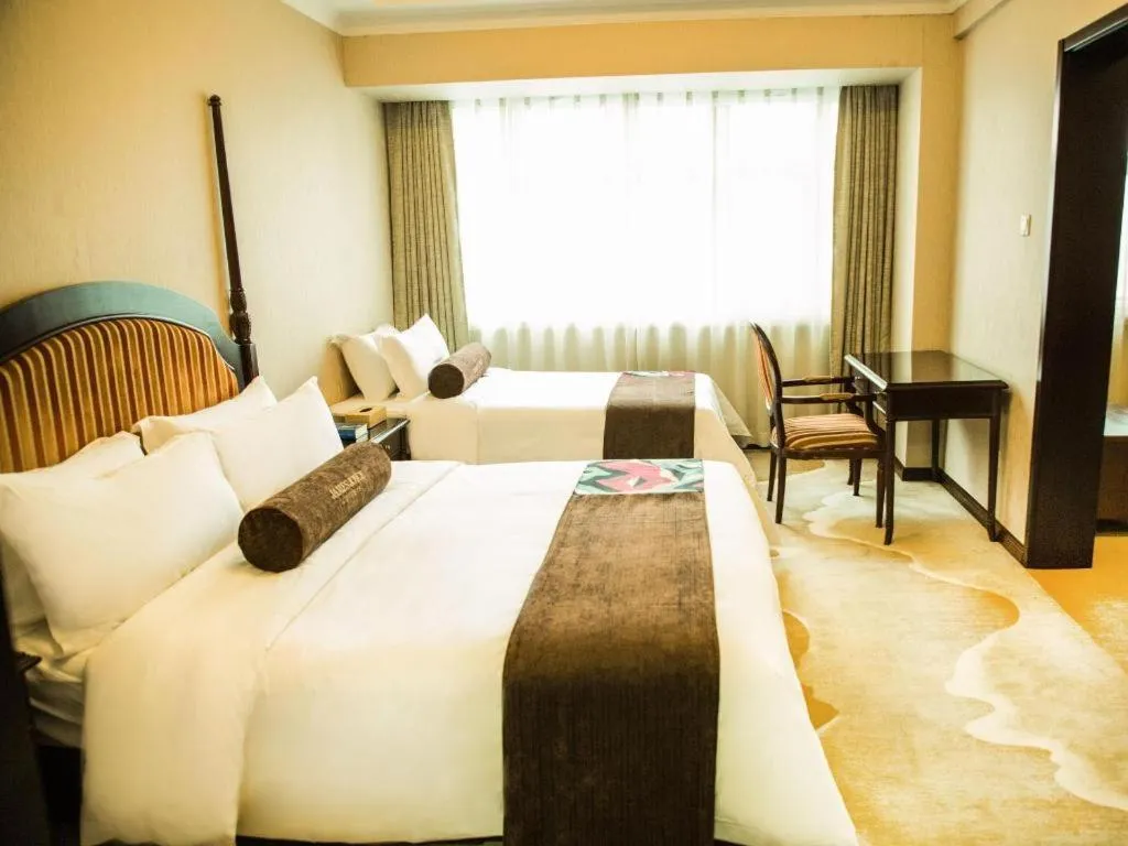 Bed in James Joyce Coffetel Qinhuangdao Taiyangcheng Wenhua Road