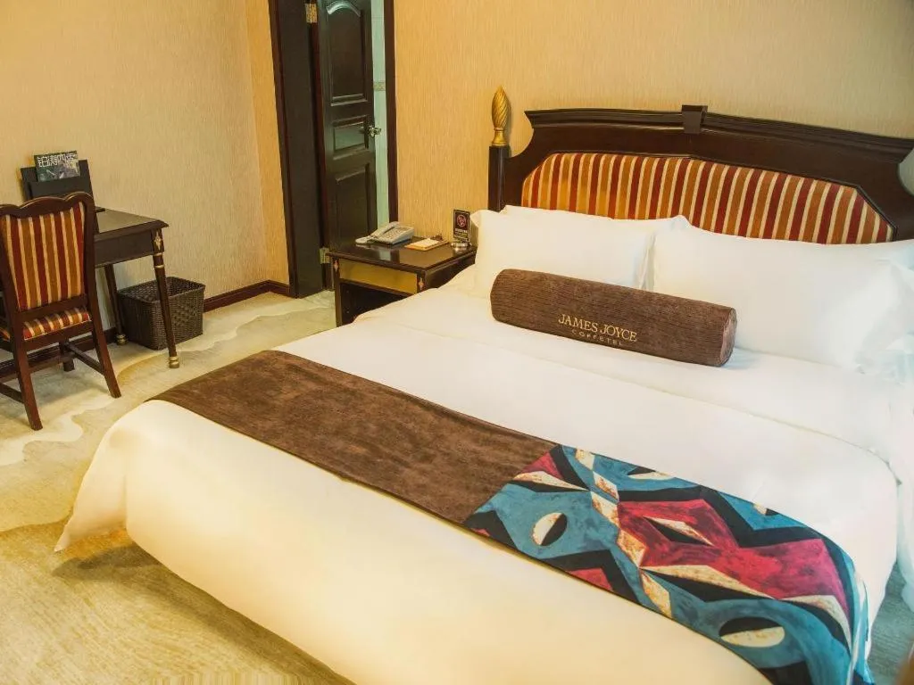 Bed in James Joyce Coffetel Qinhuangdao Taiyangcheng Wenhua Road