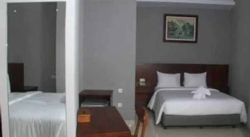 Bed in HOTEL GRAND KUTILANG SYARIAH Bed in HOTEL GRAND KUTILANG SYARIAH