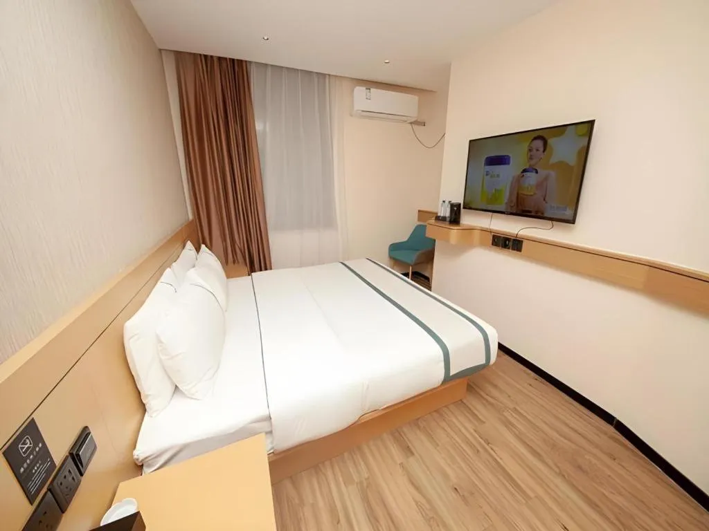 Bed in City Comfort Inn Yulin Wenhua Square Wanda Plaza