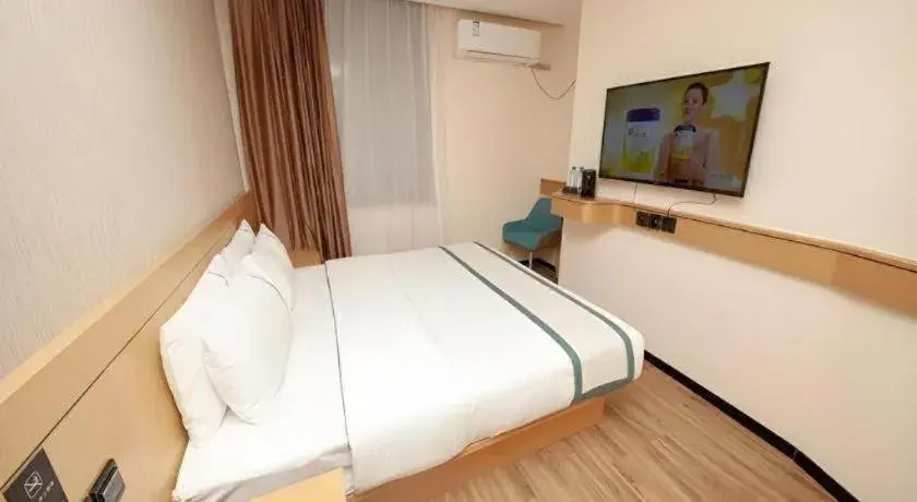 Bed in City Comfort Inn Yulin Wenhua Square Wanda Plaza Bed in City Comfort Inn Yulin Wenhua Square Wanda Plaza
