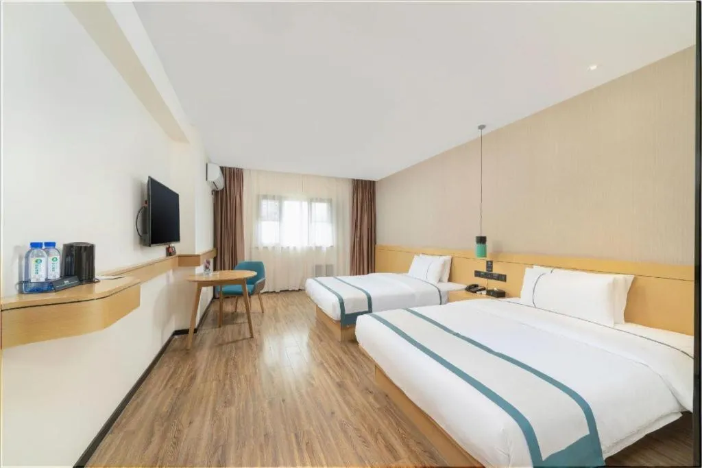 Bed in City Comfort Inn Yulin Wenhua Square Wanda Plaza
