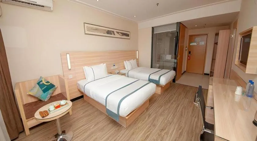 Bed in City Comfort Inn Yulin Wenhua Square Wanda Plaza