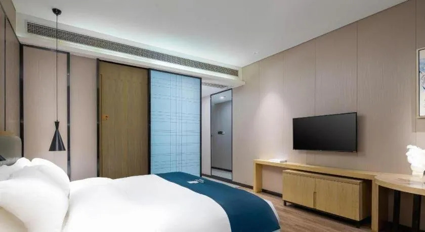 Bed in Echarm Hotel Danzhou Xiari Plaza