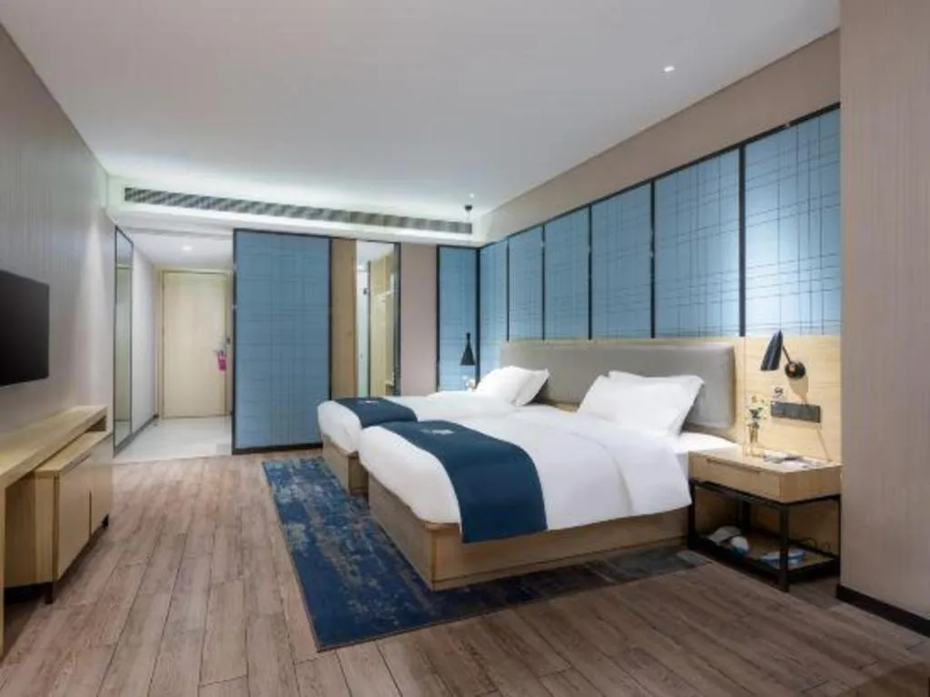 Bed in Echarm Hotel Danzhou Xiari Plaza