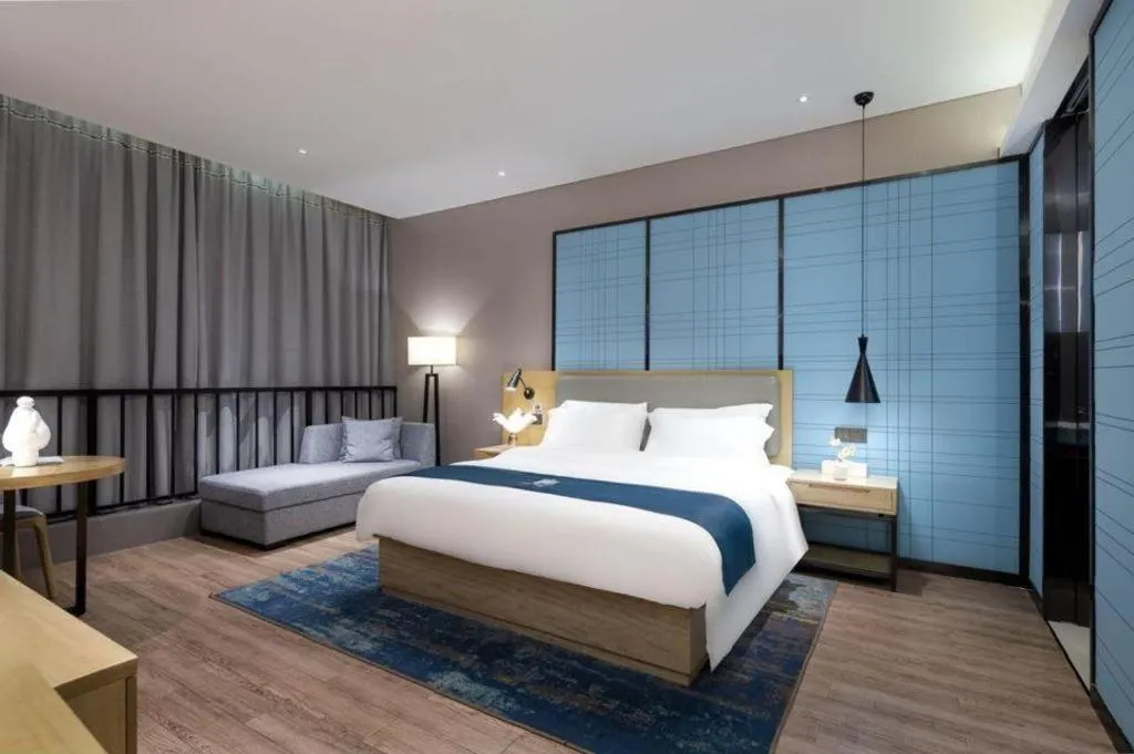Bed in Echarm Hotel Danzhou Xiari Plaza