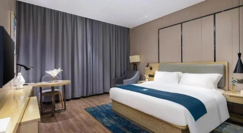 Bed in Echarm Hotel Danzhou Xiari Plaza