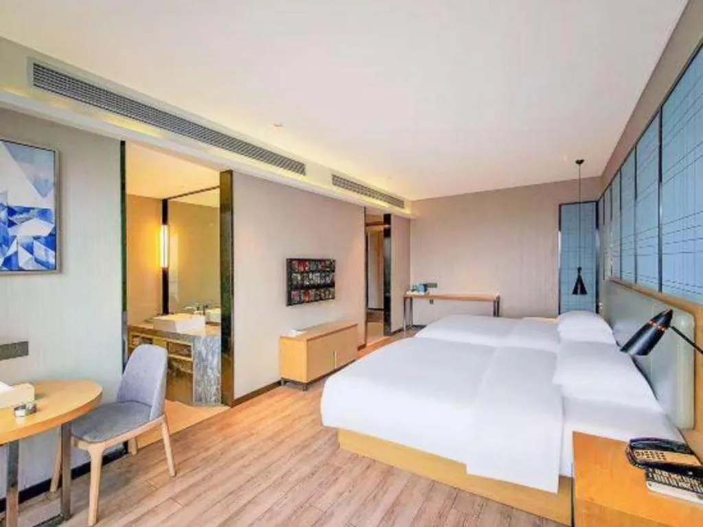 Bed in Echarm Hotel Danzhou Xiari Plaza