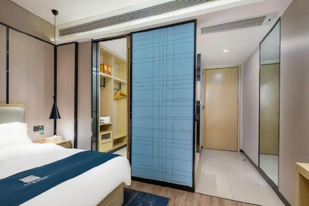 Bed in Echarm Hotel Danzhou Xiari Plaza