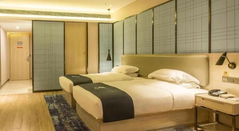 Bed in Echarm Hotel Danzhou Xiari Plaza
