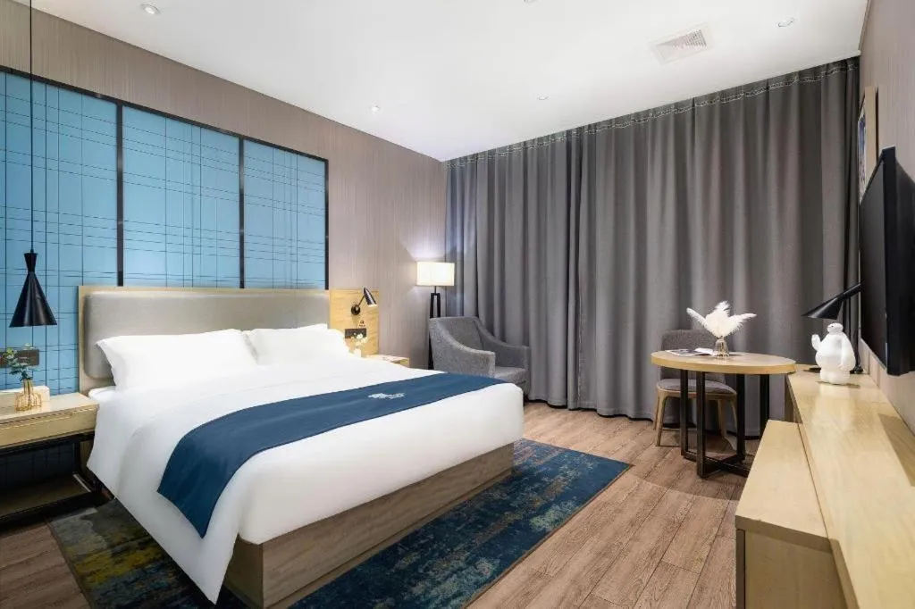 Bed in Echarm Hotel Danzhou Xiari Plaza