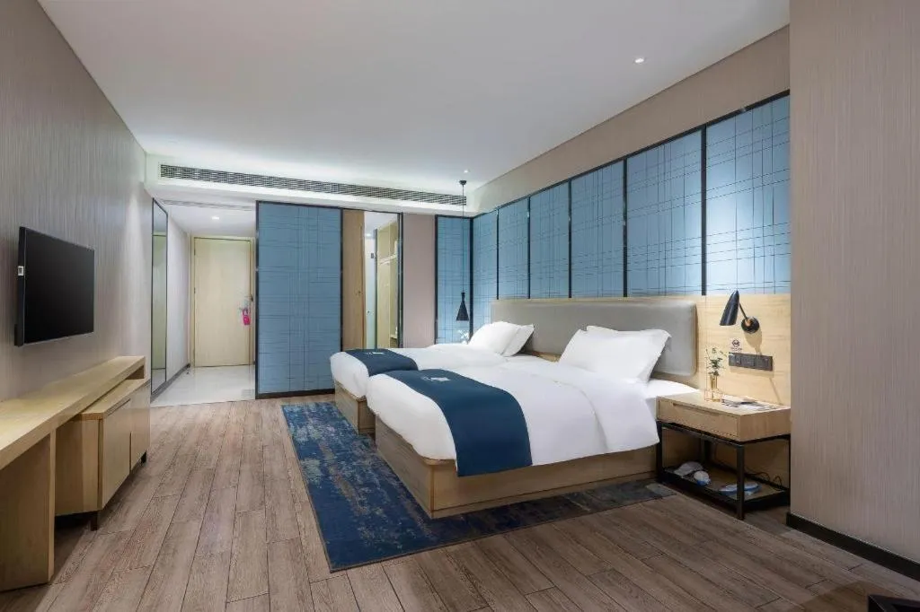 Bed in Echarm Hotel Danzhou Xiari Plaza