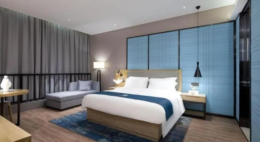 Bed in Echarm Hotel Danzhou Xiari Plaza