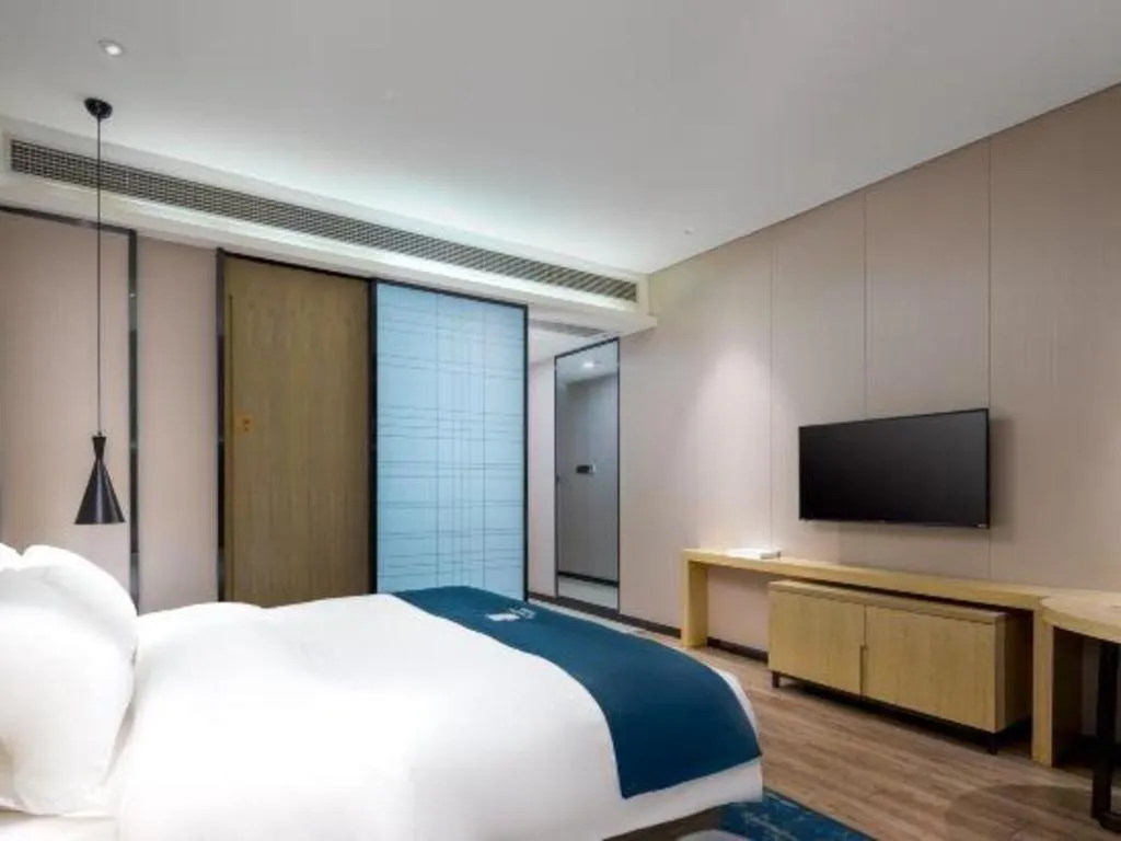 Bed in Echarm Hotel Danzhou Xiari Plaza